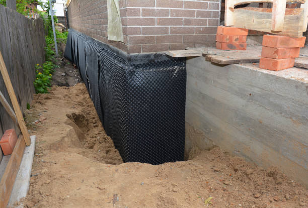 Happy homeowners after waterproofing job in Pleasant View
